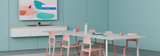 An image of a meeting room running Google Meet with a Logitech Rally Bar and Logitech Sight setup in white. The Rally Bar is at the front of the room with a screen mounted on the wall above, displaying the Google Meet home screen. The table has six chairs around it, with the Logitech Sight and Logitech Tap placed in the centre.