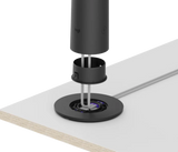 An exploded image of the Logitech Sight in graphite being secured to a table with the table mount.